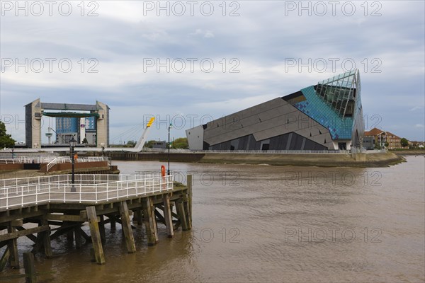 The Deep and The River Hull tidal barrier viewed from the west bank of the river Hull