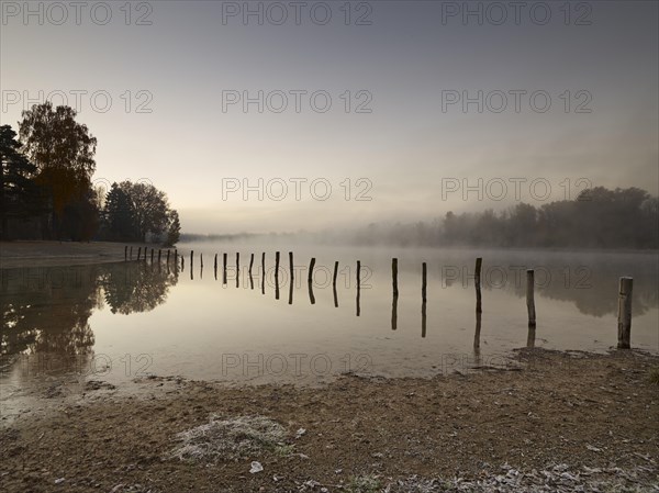 Early morning mood at Kuhsee lake with a bathing bay