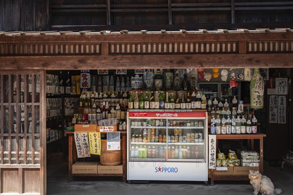 Shop sells various bottles of sake