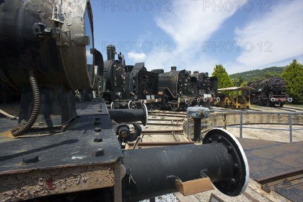 4 locomotives standing in front of the turntable
