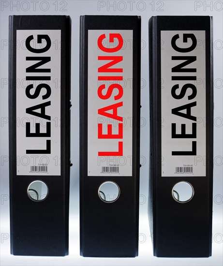 Three ring binders labelled "LEASING"
