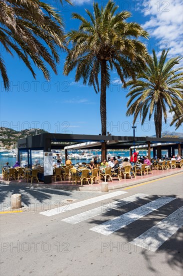 Outdoor restaurants with tourists in the bay of Puerto Andratx