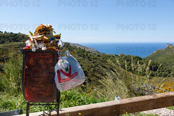 Overloaded rubbish bin at a rest stop near Estellencs
