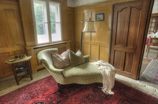 Chaise longue in the living room of a factory owner