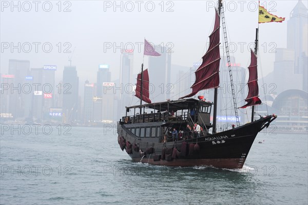 View of a boat in the bay of Victoria Harbour and Hong Kong Island