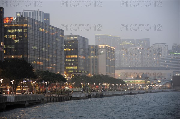 View of skyscrapers and Victoria Harbour in the evening