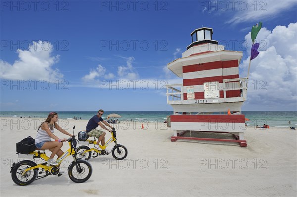 Couple riding electric bicycles
