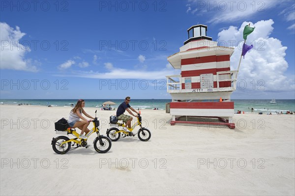 Couple riding electric bicycles