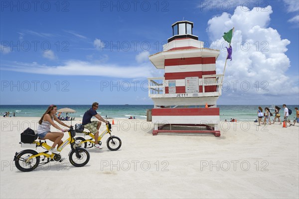 Couple riding electric bicycles