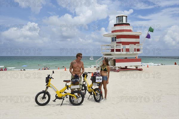 Couple riding electric bicycles