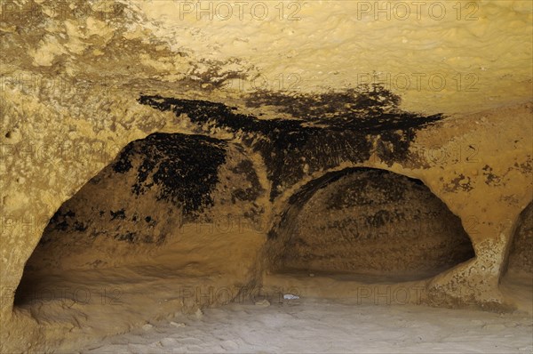 Artificial caves in the cliff