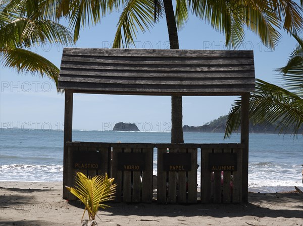 Wooden hut that serves as a waste separation station for plastic