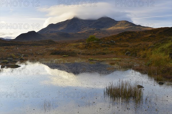 Small lake in front of the Black Cullins Mountains