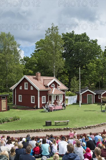 Viewers watching a scene from the children's book 'Emil of Lonneberga' by children's author Astrid Lindgren