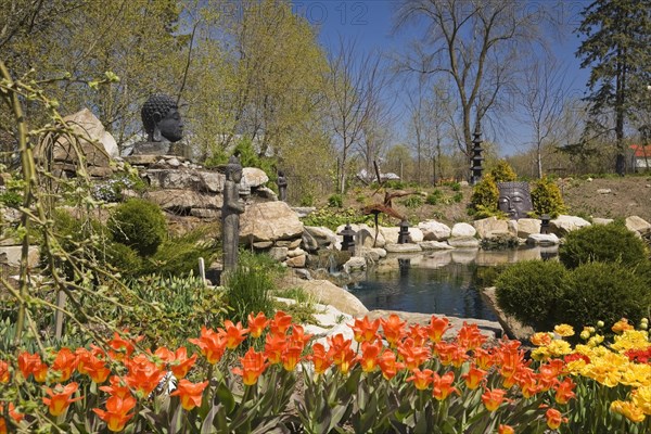 The ornamental pond in the Zen garden at springtime in the "Route des Gerbes d'Angelica" garden in Mirabel