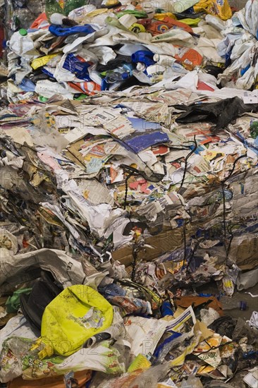 Bales of recyclable plastic containers and paper at a sorting centre