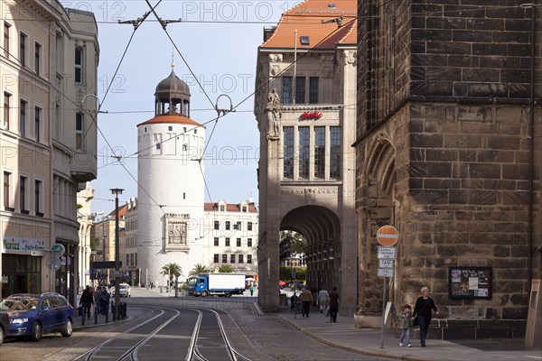 Dicker Turm tower or Frauenturm tower and an old art nouveau department store on Marienplatz square