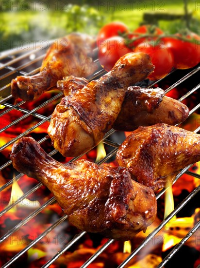 Barbecue chicken legs and thighs on a BBQ grill