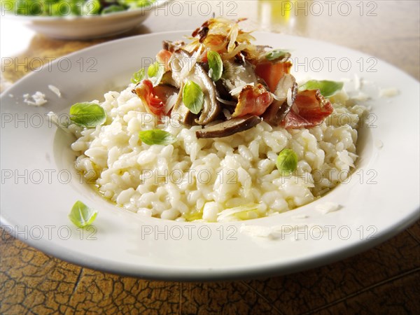 Classic risotto with wild porcini mushrooms and bacon