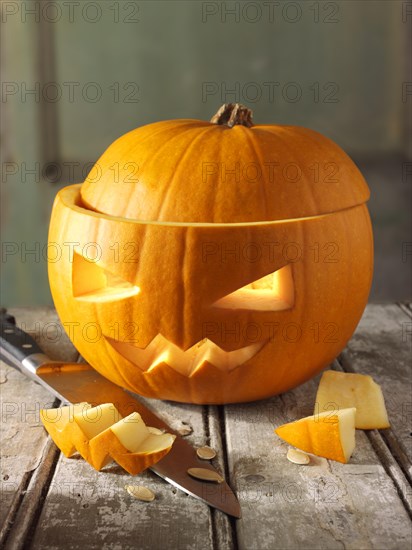 Pumpkin with a traditional carved Halloween face