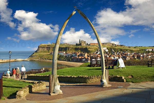 Whale Bone arch overlooking Whitby harbour with Whitby Abbey on the headland