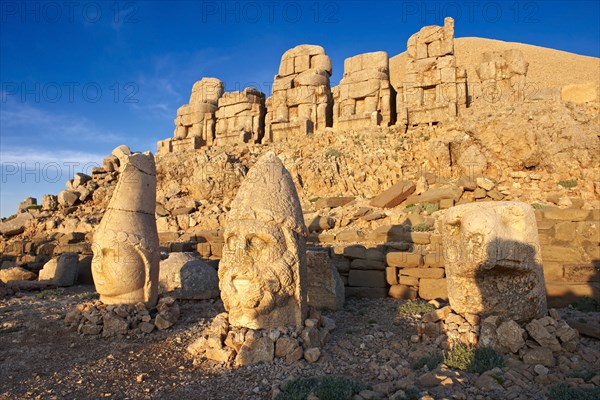 Broken statues around the tomb of Commagene King Antochius I on top of Mount Nemrut