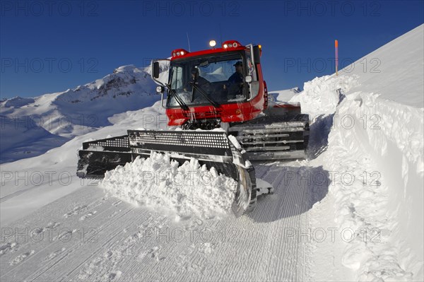 Snow groomer in winter in the mountains near Grindelwald First