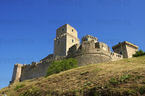 The medieval battlements of the Rocca Maggiore castle on the hilltop above Assisi