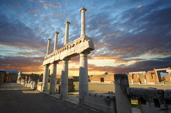 Doric and Corinthian columns of the Roman colonnade in the Forum of Pompeii