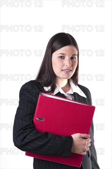 Businesswoman holding a red folder in her arm