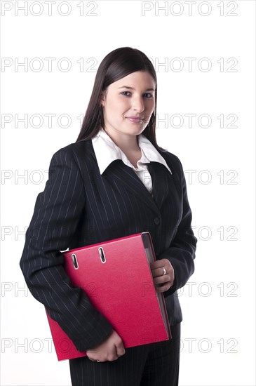 Businesswoman holding a red folder under her arm
