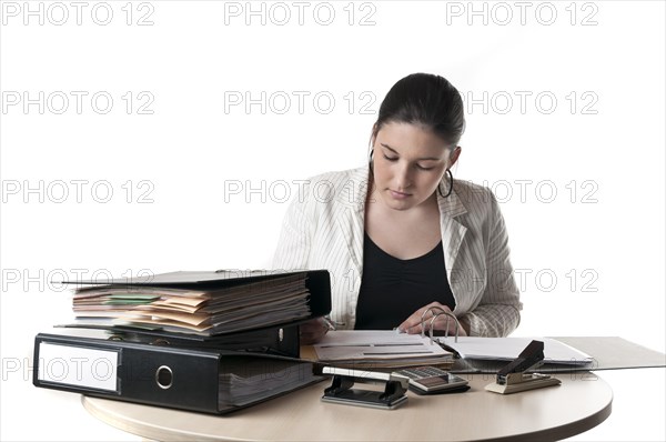 Office worker at a desk with files