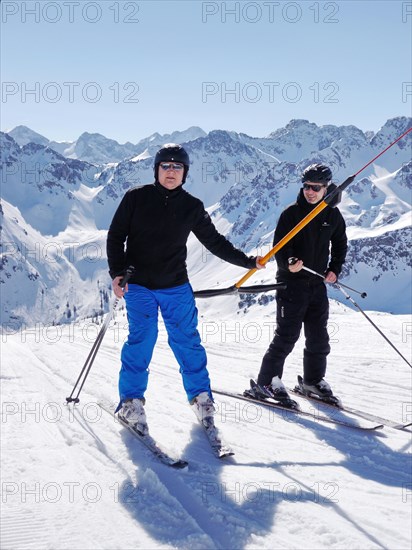 Two skiers on ski lift Fellhorn