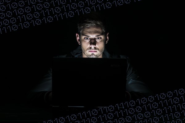 Young man sitting at a computer