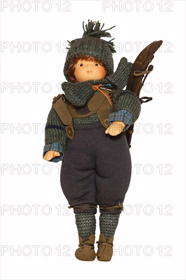 Doll with historical ski clothing and skis