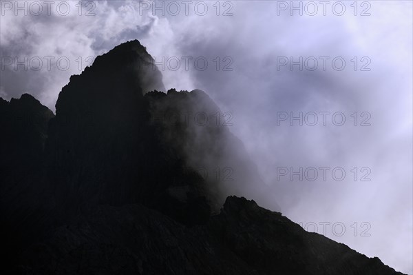 Mountain peaks in clouds