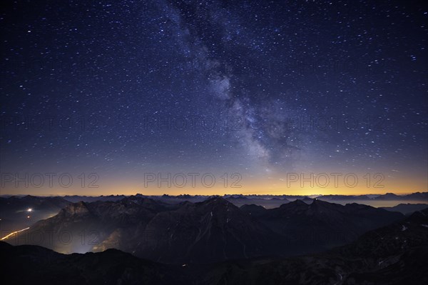 Mountains in the evening light with Milky Way and stars