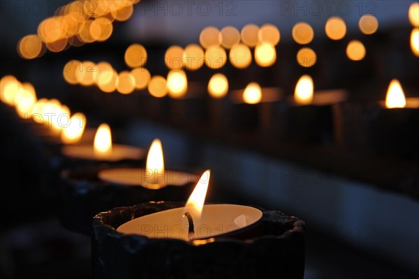 Burning candles in a church