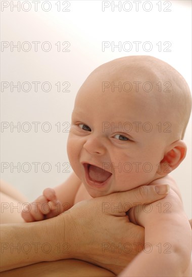 Infant being held