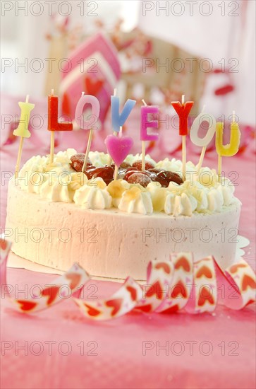 Cake with letter candles spelling the message I love you