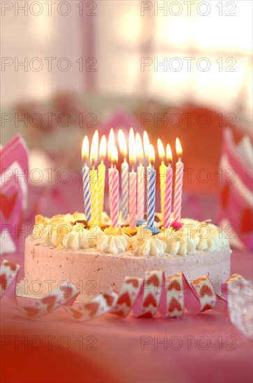 Birthday cake with burning candles *** IMPORTANT: Restriction: Blocked for usage as greeting cards and postcards until March 31