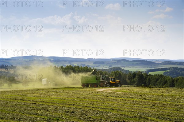 Harvester in action on a field