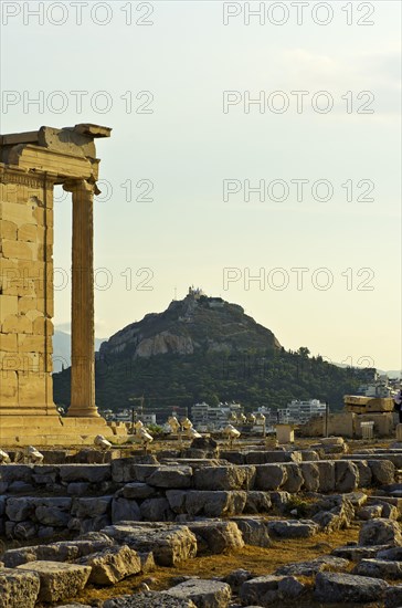 View past the Erechtheion temple towards Mount Lycabettus