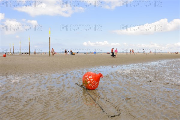 Buoy marked 'Baden Verboten' or 'No Swimming' on the beach of St. Peter-Ording