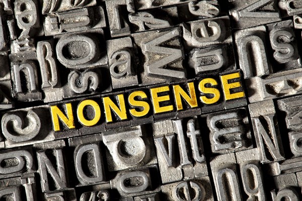 Old lead letters forming the word NONSENSE