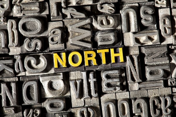 Old lead letters forming the word NORTH
