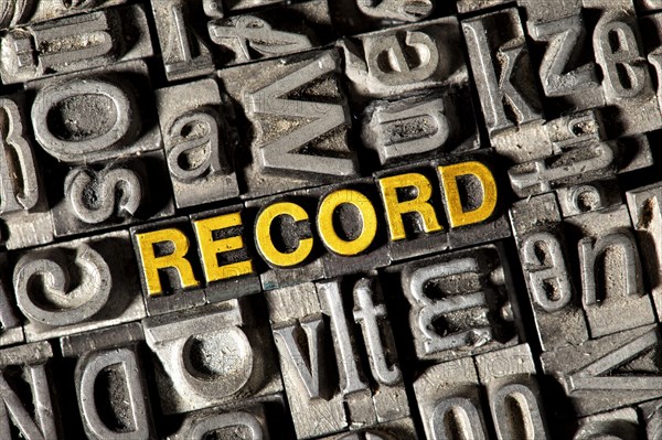 Old lead letters forming the word RECORD