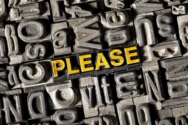 Old lead letters forming the word 'PLEASE'