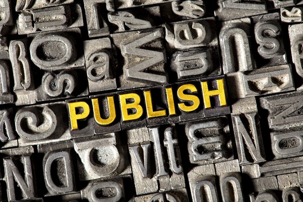Old lead letters forming the word "PUBLISH"