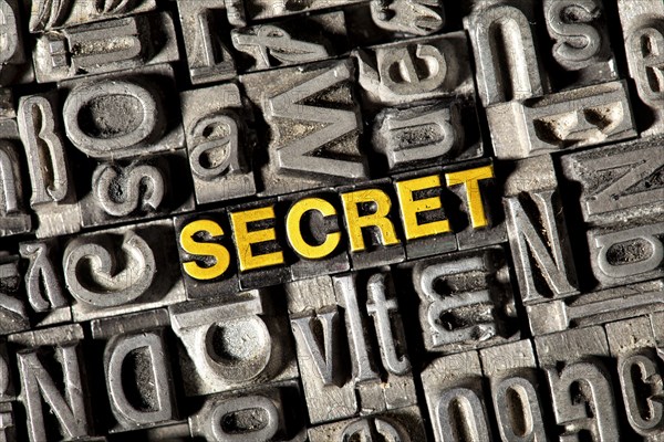 Old lead letters forming the word "SECRET"